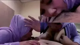 Sepongan tante jilbab ungu, bibirnya merah basah minta dijilat.